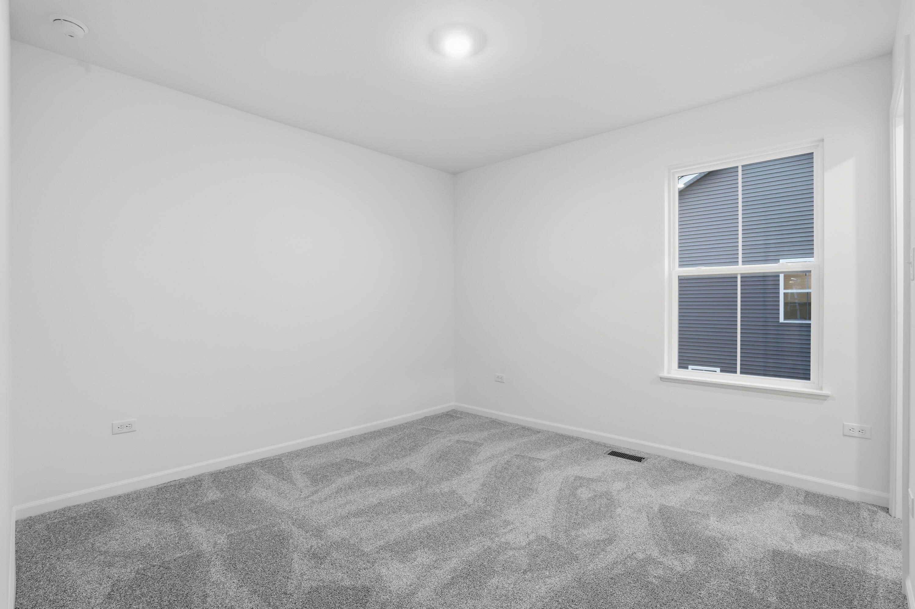 5970 East 112th Place Winfield, IN 46307 - Photo 10 of 57 an empty room with windows