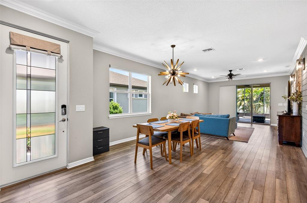 6427 Mooring Line Circle Apollo Beach, FL 33572 - Photo 11 of 34 a view of a dining room with furniture window and wooden floor