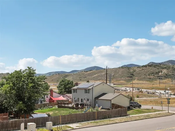 a view of a city with mountains in the background