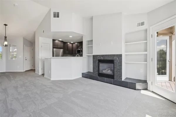 a view of a livingroom with a fireplace