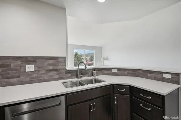 a view kitchen with a sink and cabinets