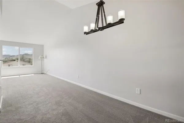 a view of empty room with floor to ceiling window