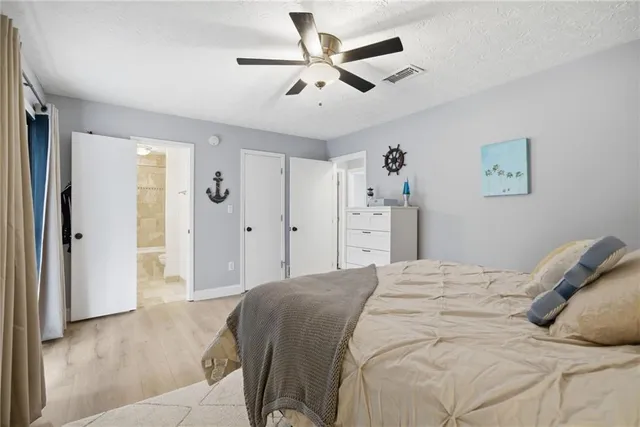 a bathroom with a double vanity sink mirror and shower