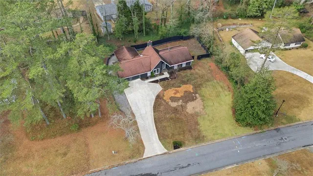 an aerial view of a house with a yard