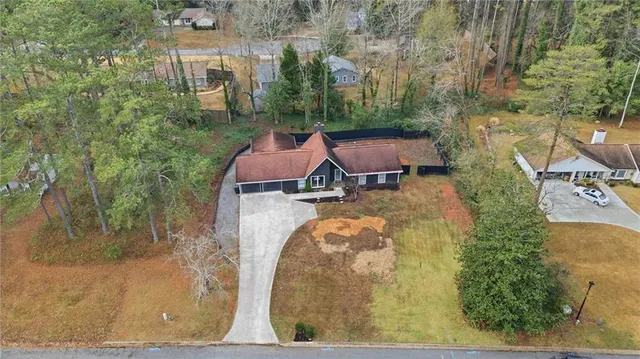 a view of a tennis ground with a yard