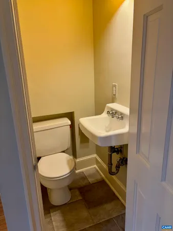 a bathroom with a toilet and a sink