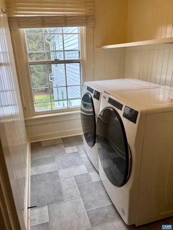 a utility room with dryer and washer