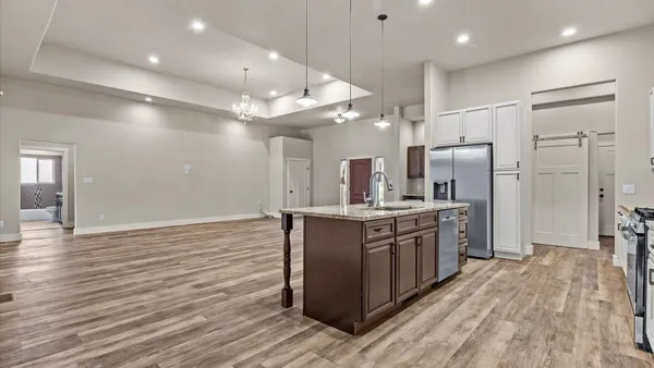 a view of cabinets with wooden floor