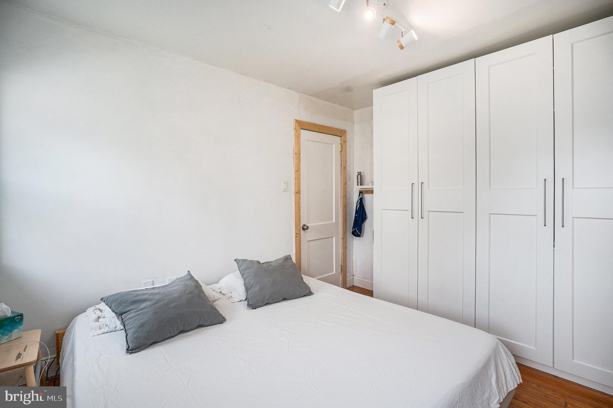 7238 Hollywood Road Fort Washington, PA 19034 - Photo 15 of 27 a bedroom with a bed and a chandelier