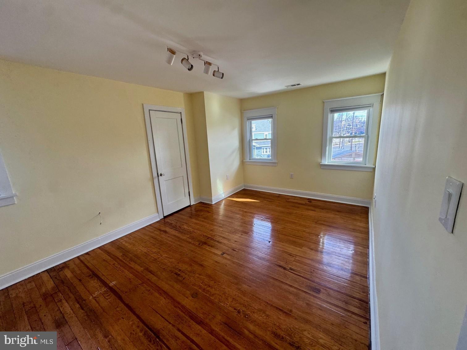 7238 Hollywood Road Fort Washington, PA 19034 - Photo 17 of 27 a view of empty room with wooden floor and fan