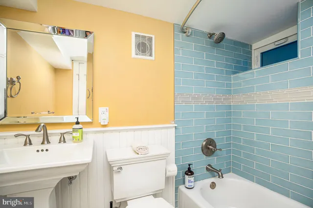 a bathroom with a sink and a bathtub