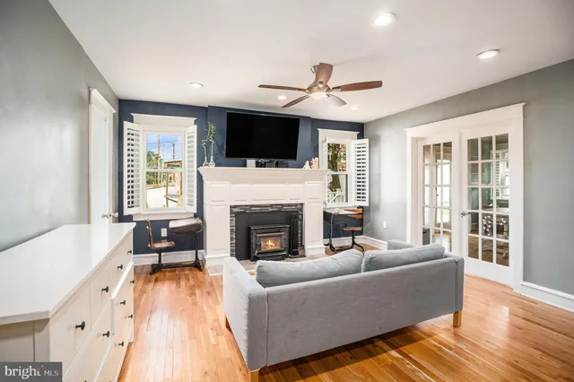 a living room with furniture fireplace and flat screen tv