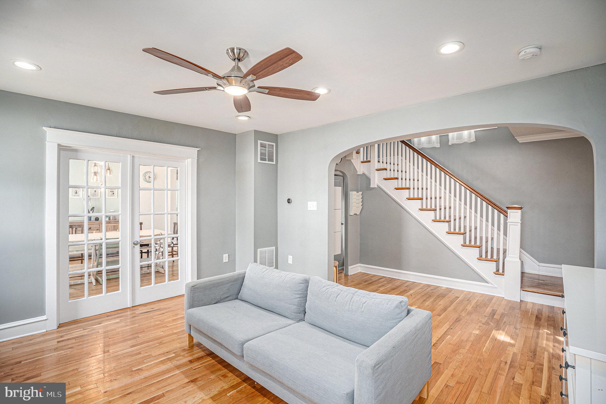 7238 Hollywood Road Fort Washington, PA 19034 - Photo 6 of 27 a living room with wooden floor and a ceiling fan