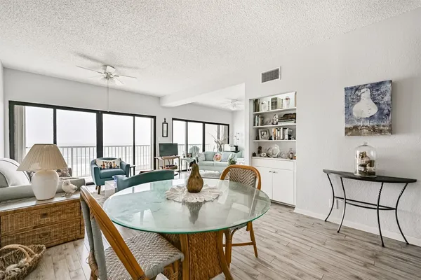 a view of a dining room with furniture window and outside view