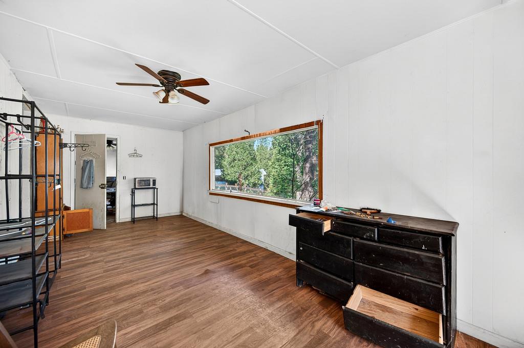5404 Forbestown Road Forbestown, CA 95941 - Photo 12 of 14 a living room with hard wood floors and a window