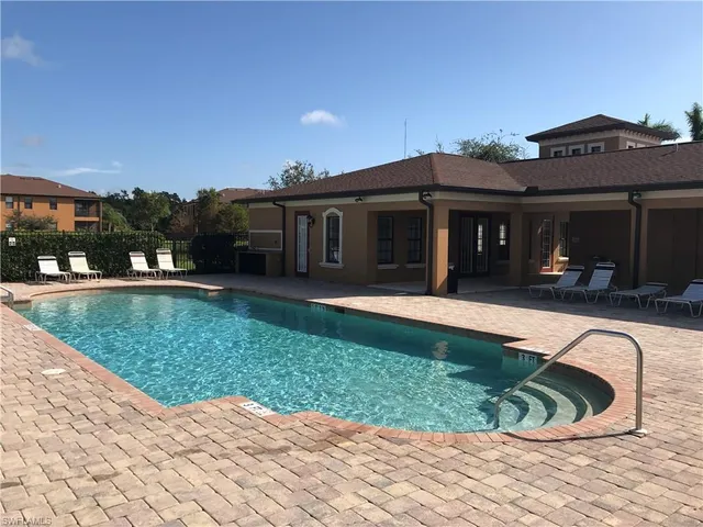 a view of a house with backyard and porch