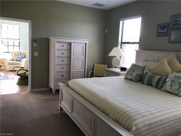 a bedroom with a bed and a closet