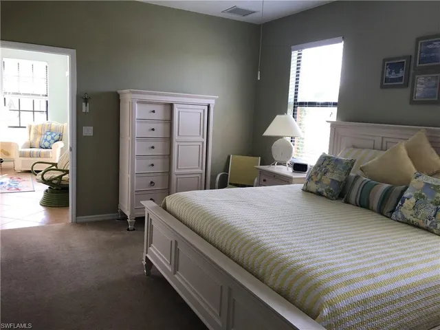 a bedroom with a bed and a closet