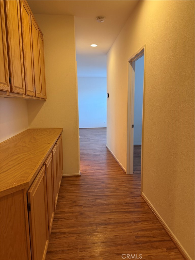 24972 Butterchurn Road Wildomar, CA 92595 - Photo 21 of 45 Hallway to Front Room with Storage Cabinets