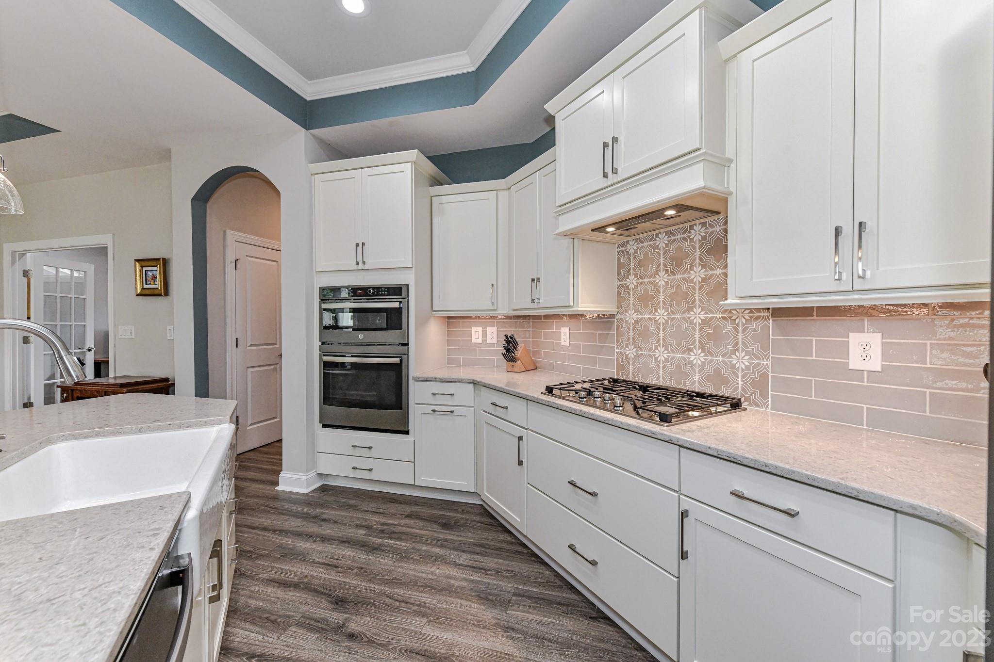 2330 Wesley Landing Road Waxhaw, NC 28173 - Photo 14 of 47 a kitchen with stainless steel appliances granite countertop a stove and a sink