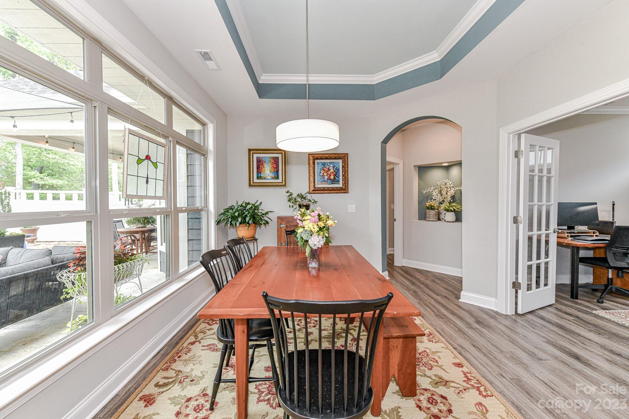 2330 Wesley Landing Road Waxhaw, NC 28173 - Photo 17 of 47 a view of a dining room with furniture window and wooden floor