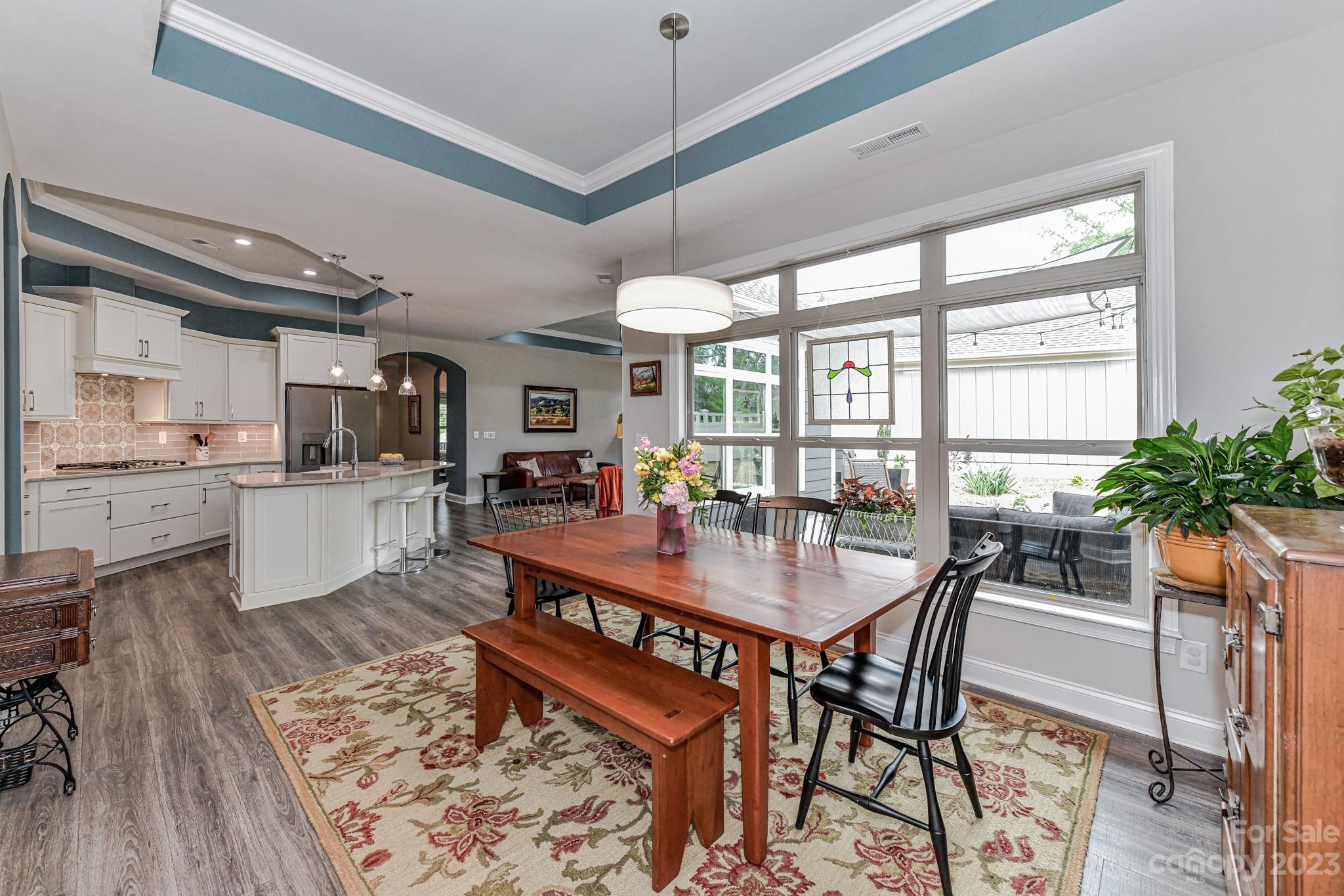 2330 Wesley Landing Road Waxhaw, NC 28173 - Photo 19 of 47 a dining room with furniture window and wooden floor