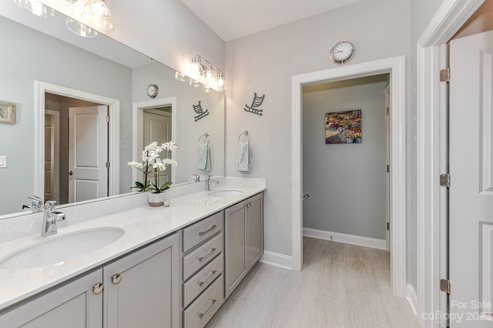 2330 Wesley Landing Road Waxhaw, NC 28173 - Photo 25 of 47 a bathroom with a double vanity sink and a mirror