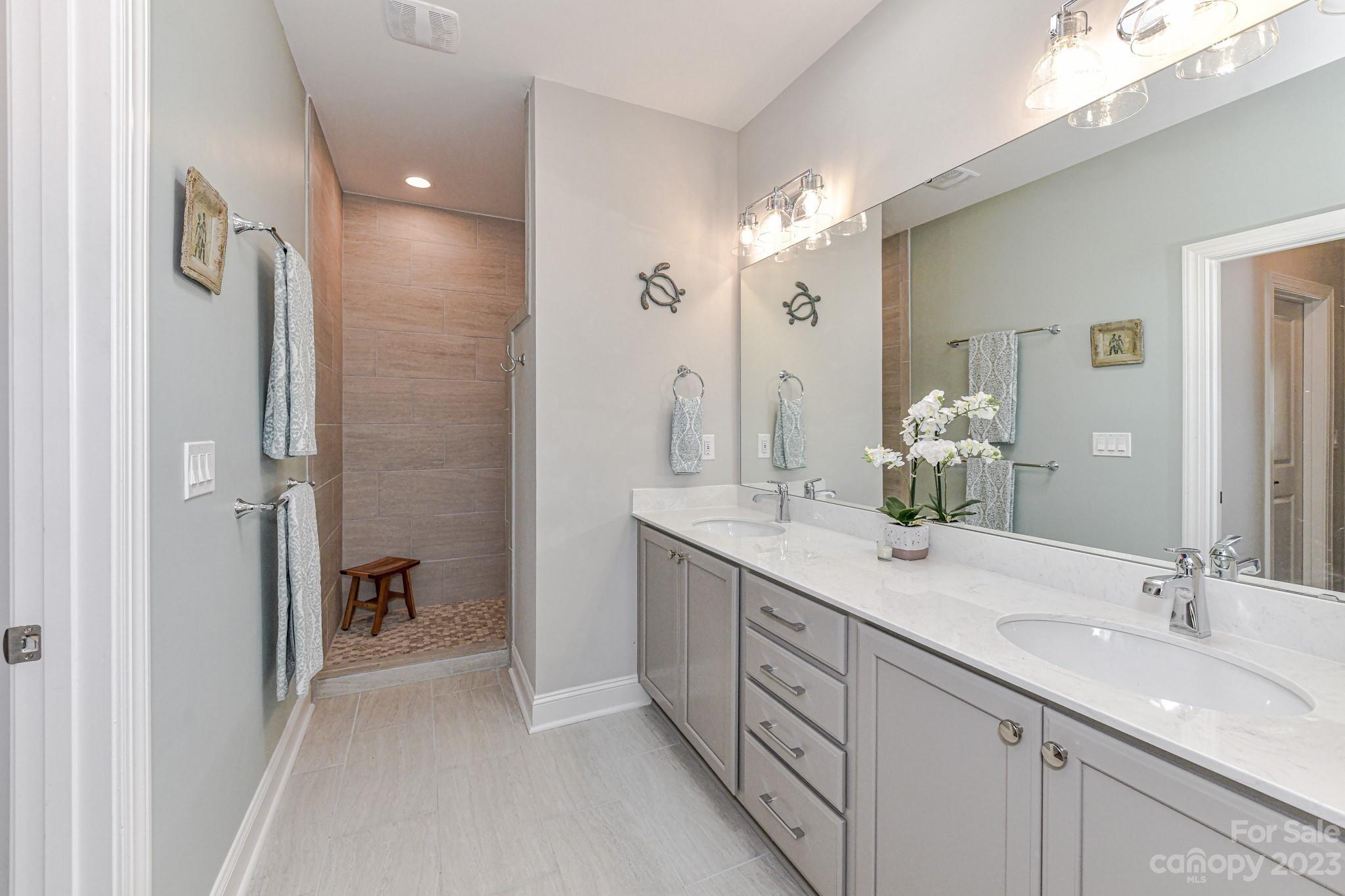 2330 Wesley Landing Road Waxhaw, NC 28173 - Photo 26 of 47 a spacious bathroom with a double vanity sink mirror and double