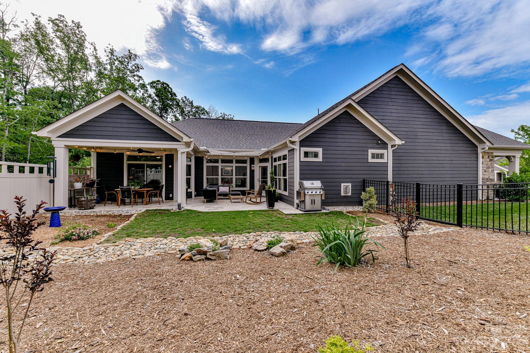 2330 Wesley Landing Road Waxhaw, NC 28173 - Photo 3 of 47 a front view of a house with garden