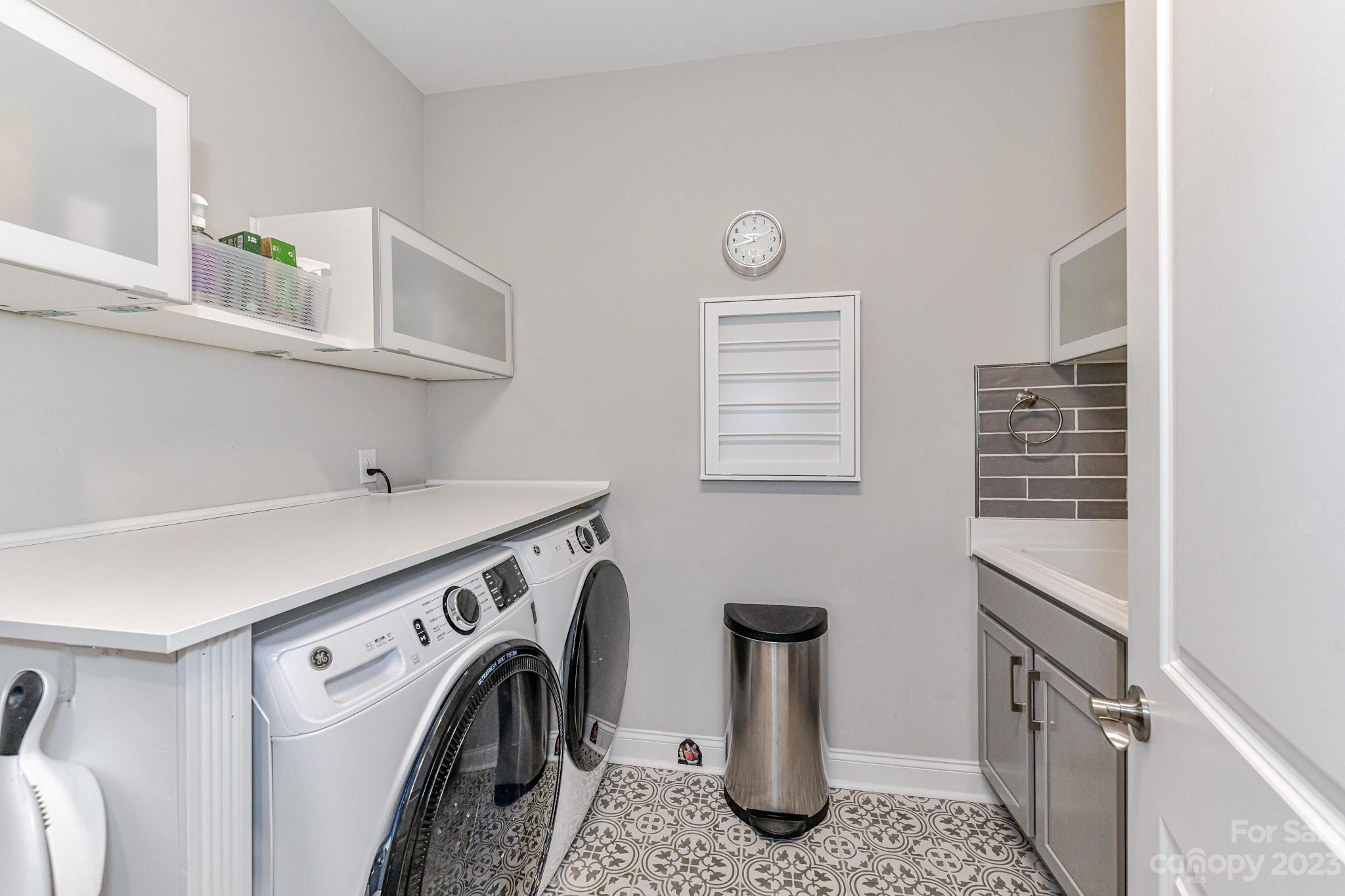 2330 Wesley Landing Road Waxhaw, NC 28173 - Photo 32 of 47 a utility room with sink dryer and washer
