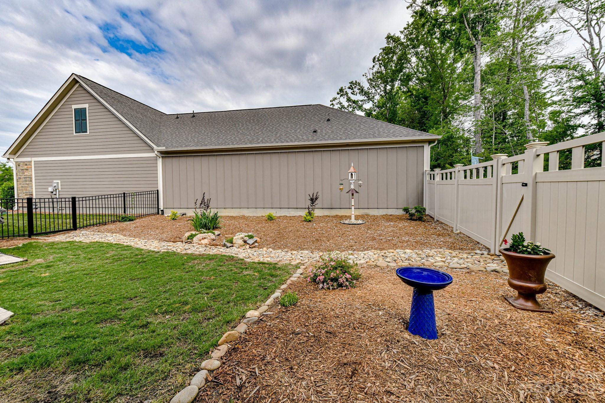 2330 Wesley Landing Road Waxhaw, NC 28173 - Photo 39 of 47 a front view of a house with garden