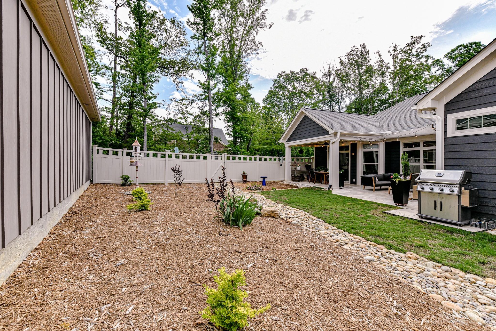 2330 Wesley Landing Road Waxhaw, NC 28173 - Photo 41 of 47 a view of a house with backyard and a tree