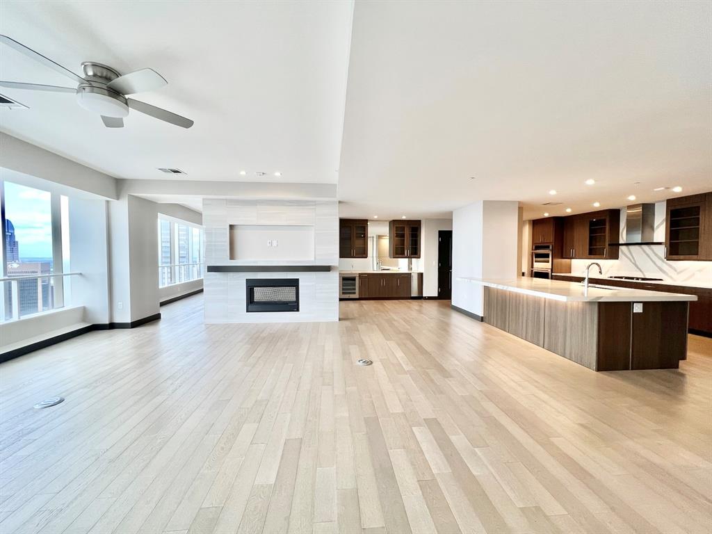 1401 Elm Street, Unit 4601 Dallas, TX 75202 - Photo 1 of 1 a large white kitchen with a cabinetry and kitchen view