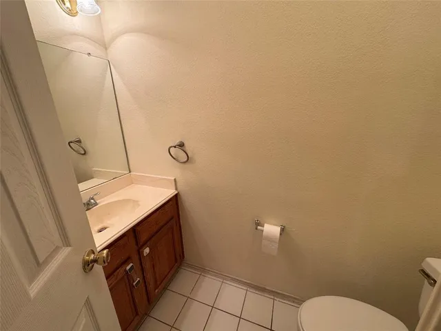 a bathroom with a sink toilet and vanity
