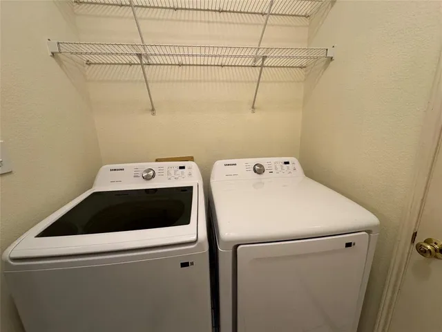 a utility room with dryer and washer