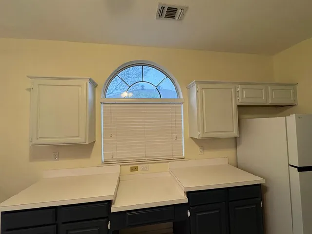 a bathroom with a sink a vanity and a shower