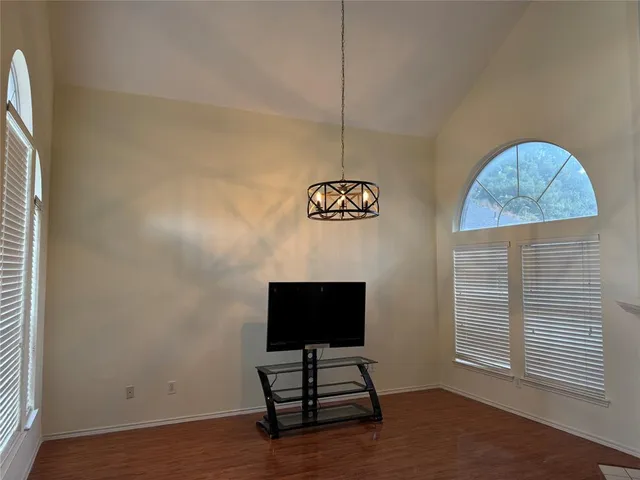 a view of room with a flat screen tv and a ceiling fan