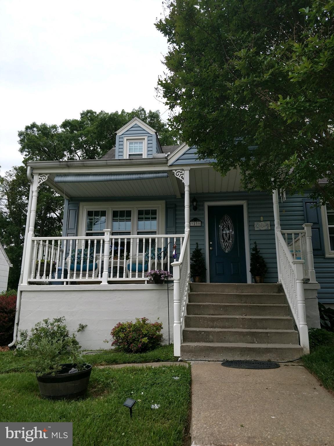 1239 Landover Road Baltimore, MD 21237 - Photo 2 of 13 a house view with a garden space