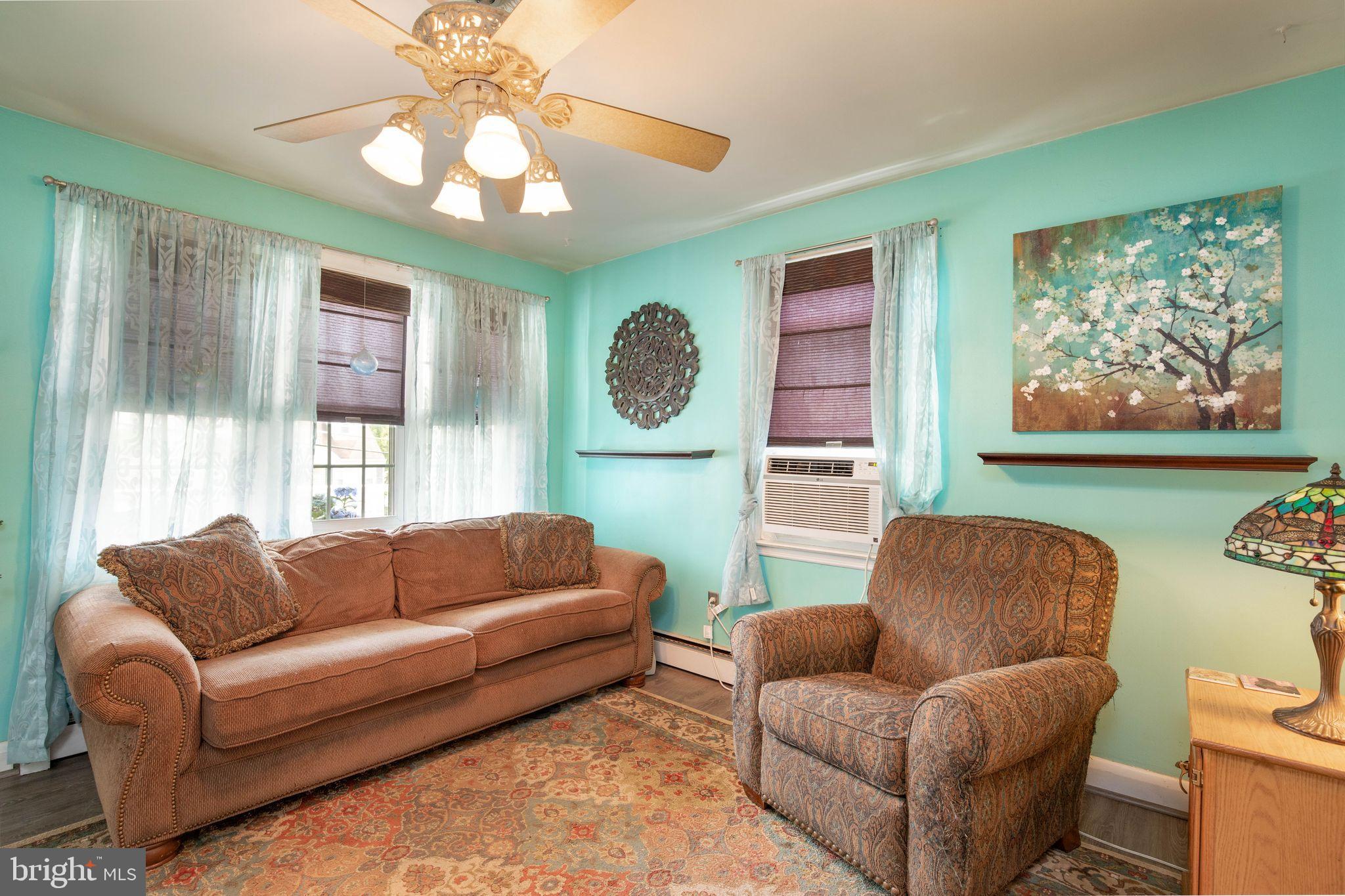 1239 Landover Road Baltimore, MD 21237 - Photo 7 of 13 a living room with furniture and a large window