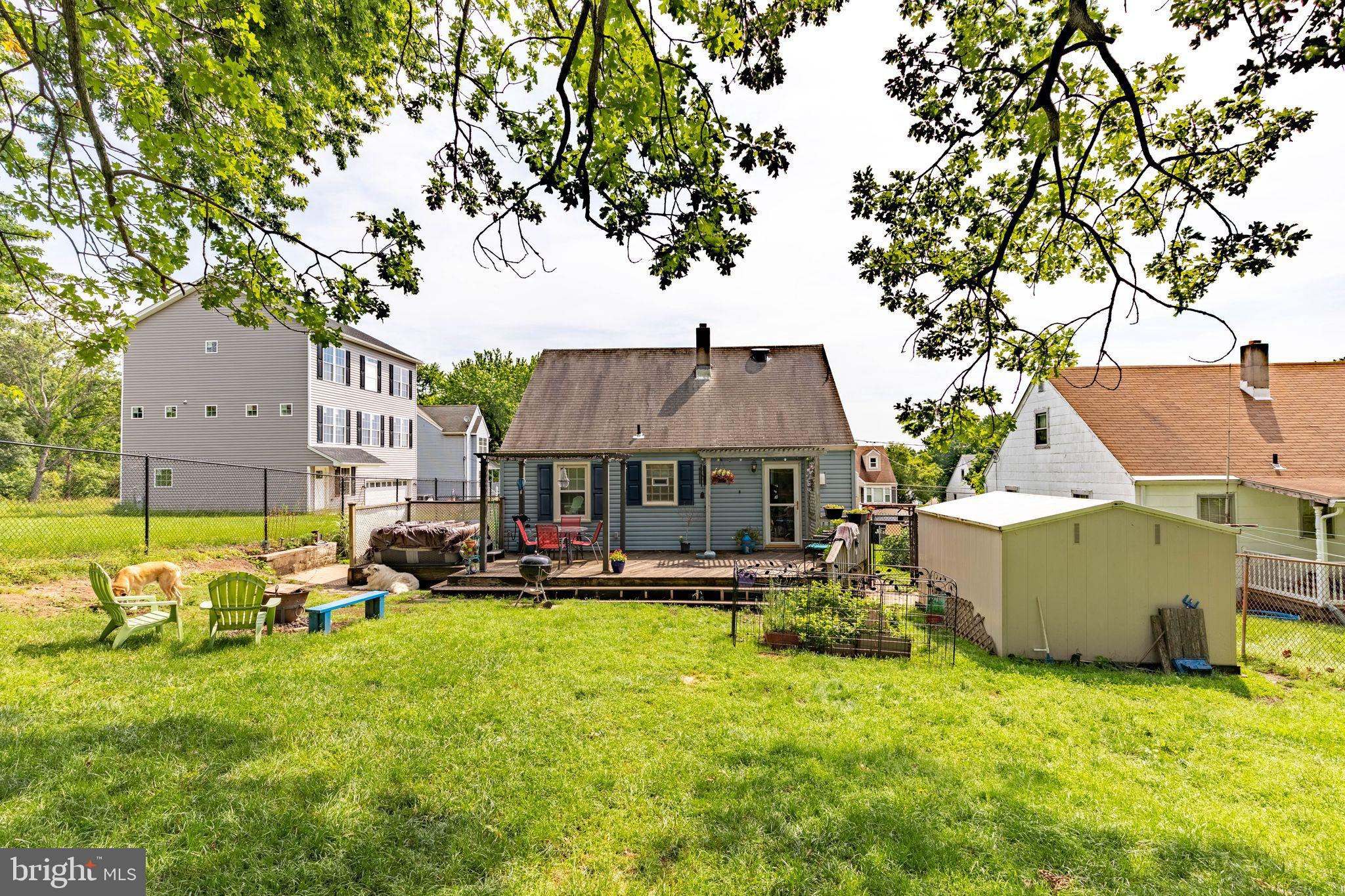 1239 Landover Road Baltimore, MD 21237 - Photo 10 of 13 a view of a house with a big yard