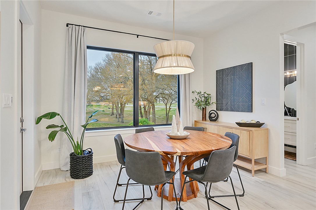 10704 Harvey Ranch Road College Station, TX 77845 - Photo 13 of 18 a view of a dining room with furniture window and outside view