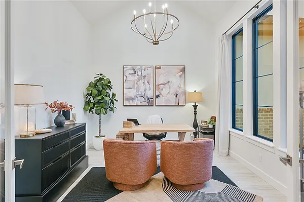 a bathroom with a granite countertop sink a toilet and a mirror