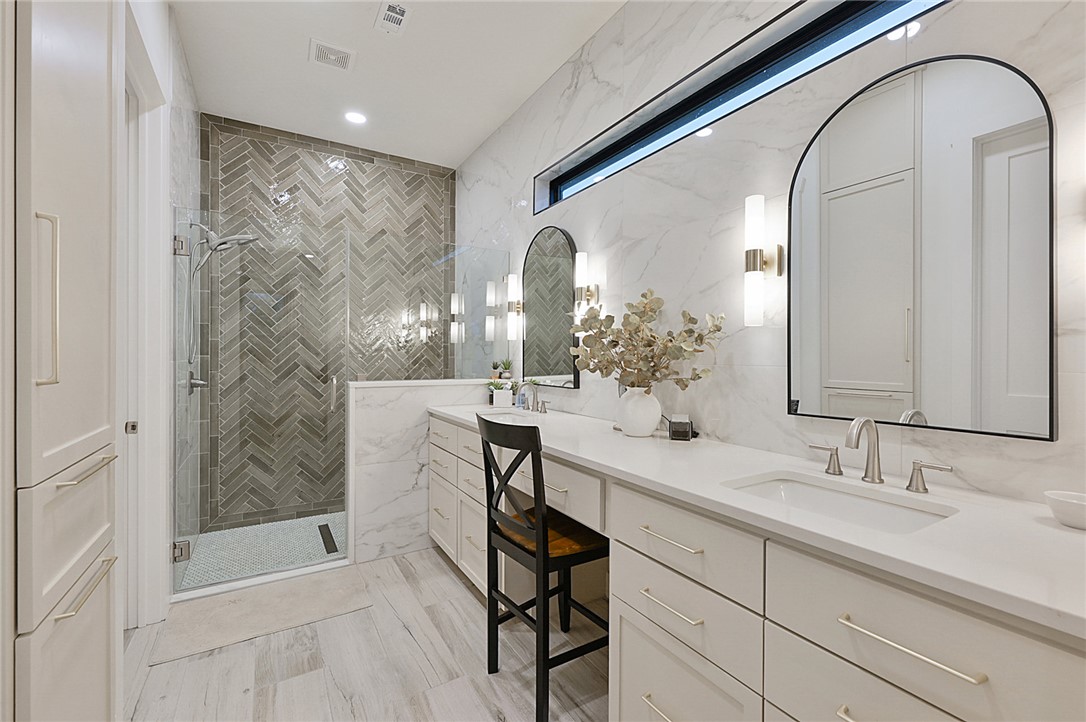 10704 Harvey Ranch Road College Station, TX 77845 - Photo 18 of 18 a bathroom with a sink and a mirror