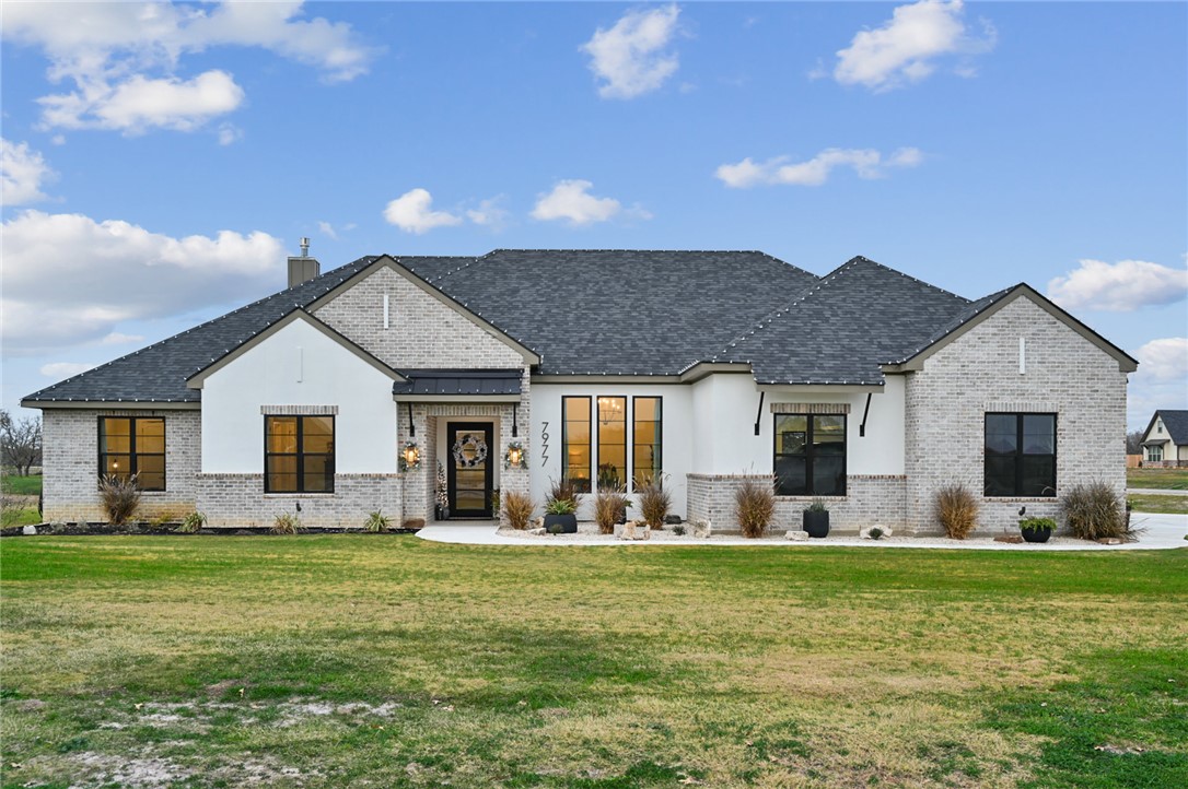 10704 Harvey Ranch Road College Station, TX 77845 - Photo 10 of 18 a front view of house with yard outdoor seating and green space