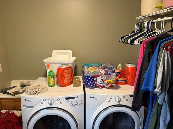 a utility room with dryer and washer