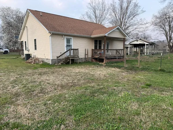 a front view of house with yard and porch
