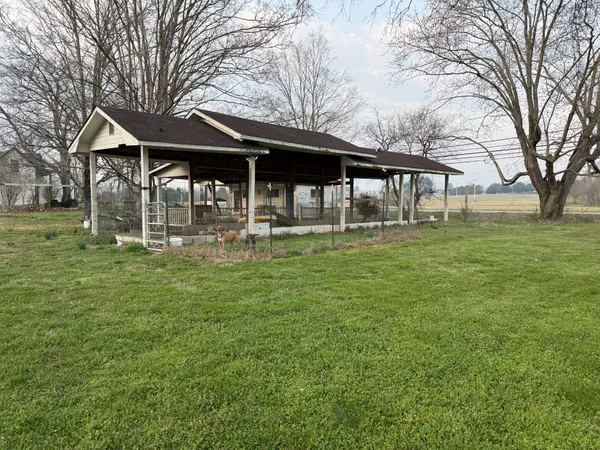 a front view of house with a garden