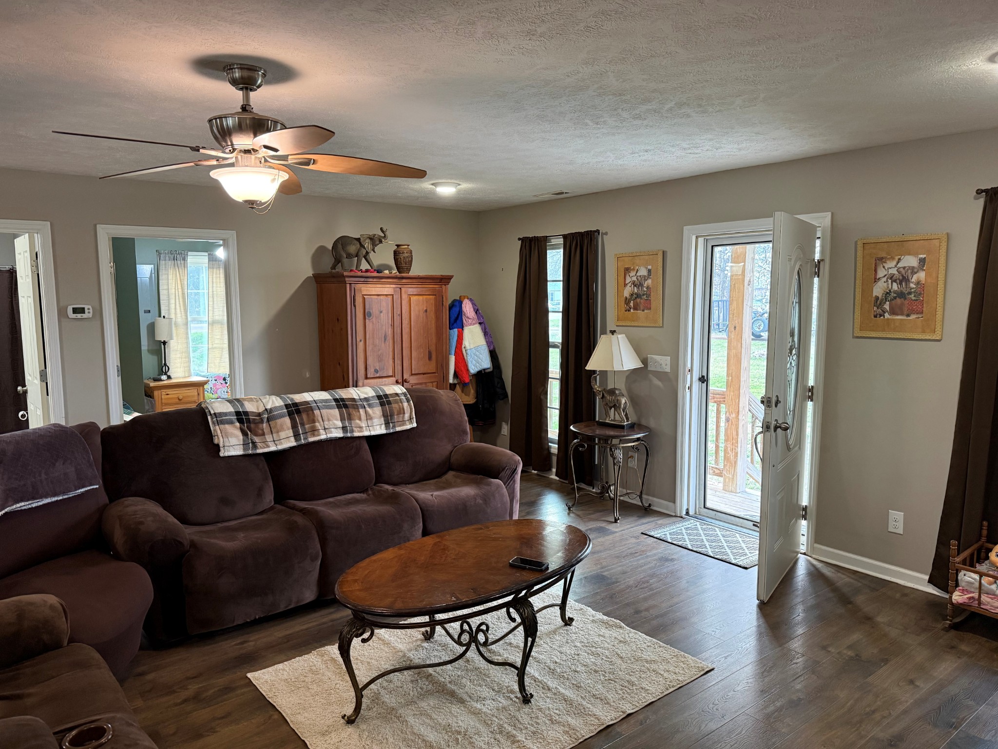 7719 Elkton Pike Prospect, TN 38477 - Photo 2 of 17 a living room with furniture and a chandelier