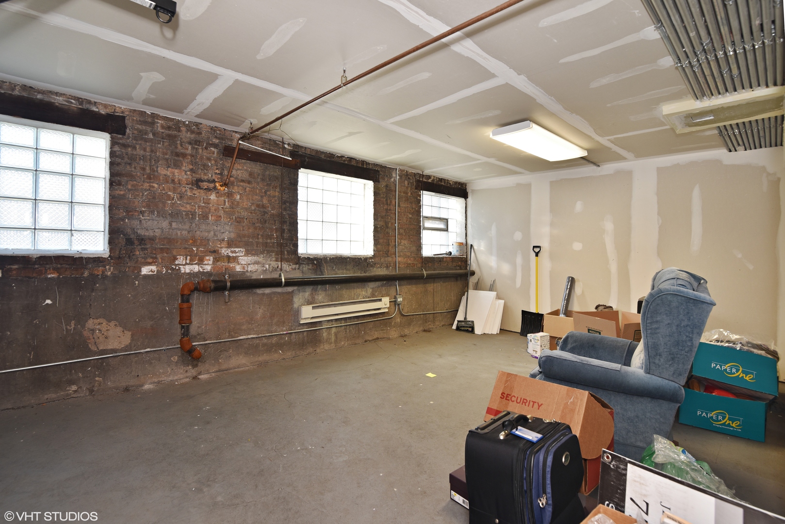 1750 West Rascher Avenue, Unit 2 Chicago, IL 60640 - Photo 11 of 11 a living room with furniture gym equipment and a window