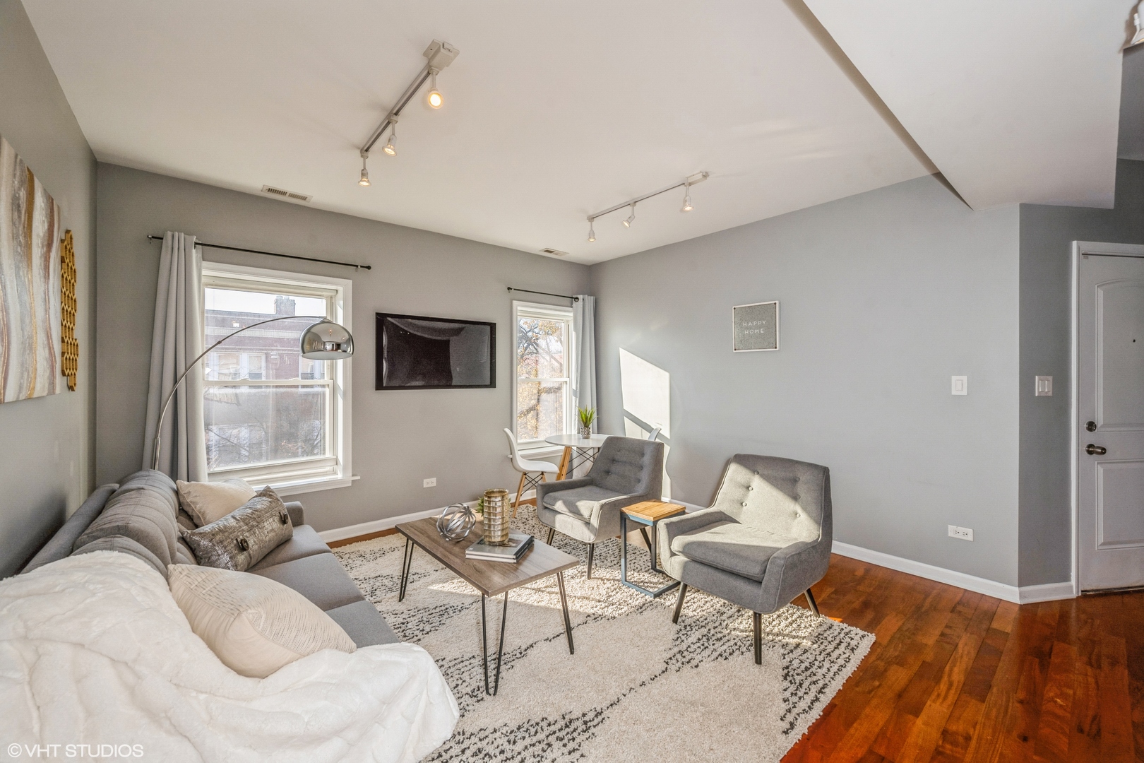 1750 West Rascher Avenue, Unit 2 Chicago, IL 60640 - Photo 3 of 11 a living room with furniture and a flat screen tv